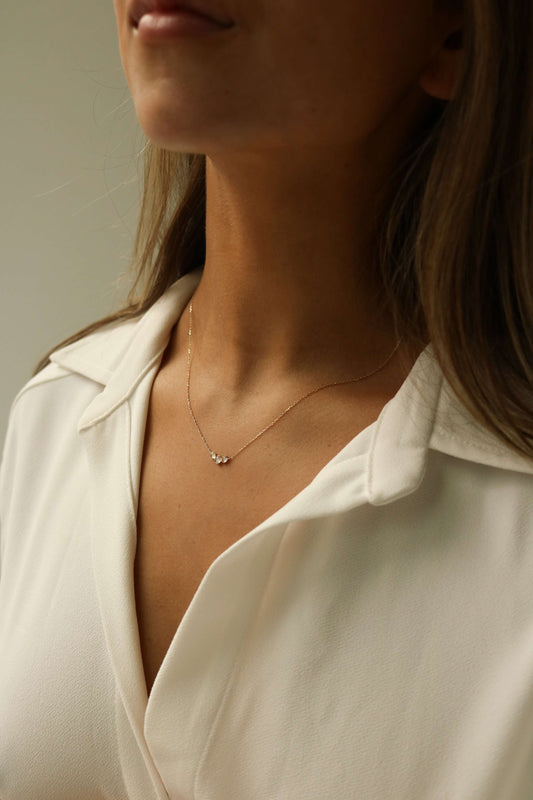 three stone moonstone pendant made of 14k solid gold with a dainty minimal chain